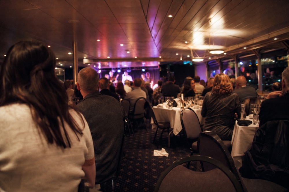 Dinner cruise interior with live music, no text, no logos, no people