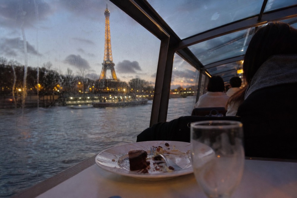 Seine river view from a dinner cruise window, no text, no logos, no people