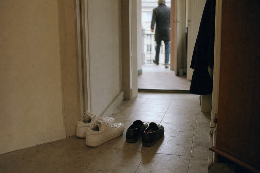 Clean white leather sneakers beside loafers as cruise footwear options, no text, no logos, no people